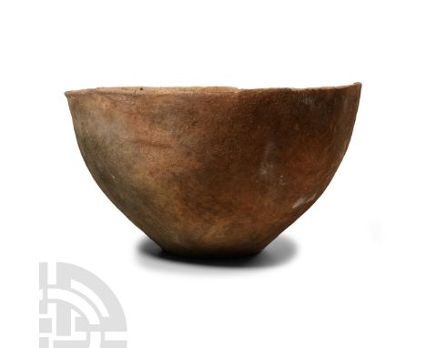 Early Bronze Age I, 3rd millennium B.C. Of squat profile with slightly chamfered rim.  1.06 kg, 21.5 cm wide (8 1/2 in.). Fro