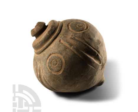 9th-11th century A.D. Piriform body with segmented shoulder and impressed roundels, domed filler-hole, intended to be filled 