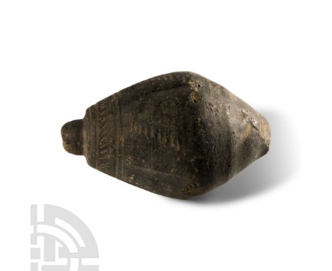 9th-11th century A.D. Biconvex body with impressed billeted bands and domed filler-hole, intended to be filled with explosive