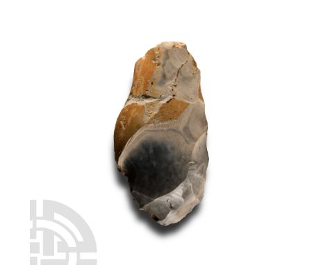 Neolithic Period, 6000-4000 years B.P. Biconvex in section with rounded cutting edge, much cortex remaining.  201 grams, 10.5