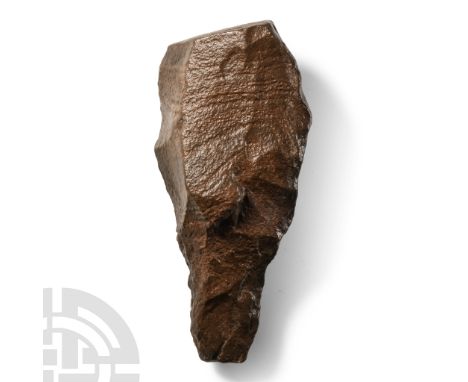 Lower Palaeolithic Period, circa 400,000-200,000 B.P. Large sub-triangular form with square butt and tip absent, heavily pati