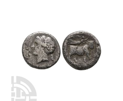 c.275-250 B.C. Obv: head of nymph left; cornucopia (?) to right. Rev: man-headed bull walking right; above, crowning Nike fly