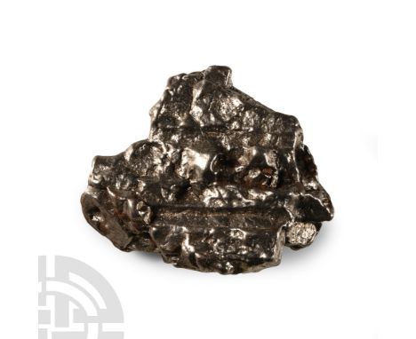 Fell 6000-5000 years B.P. A nickel-iron meteorite (IAB).  22.2 grams, 28 mm (1 1/8 in.). From a Lincolnshire, UK, collection.