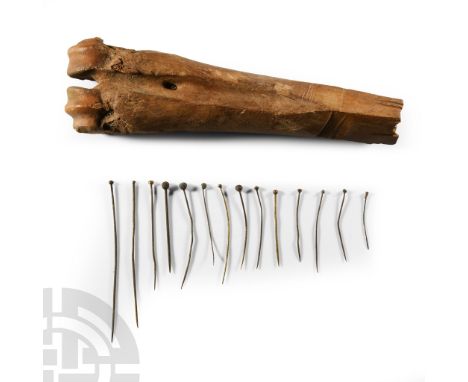 15th-16th century A.D. Epiphesis of a bovine long bone with the end worked into a square-section block with vertical slots to