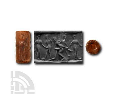 Circa 1800 B.C. Agate cylinder with intaglio figural scenes; supplied with a museum-quality impression.  2.70 grams, 19 mm (3