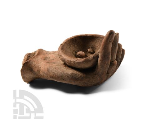 Circa 6th-2nd century B.C. Left hand modelled in the round with a ring to the third finger formed with a broad discoid bezel,