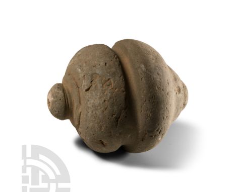 9th-11th century A.D. Piriform body with gusset to the equator, domed filler-hole, intended to be filled with explosive liqui