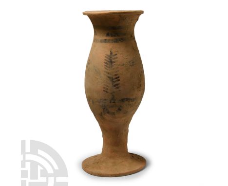 1st millennium B.C. With fusiform body and broad carinated rim, short stem and flared base; circumferential painted bands and