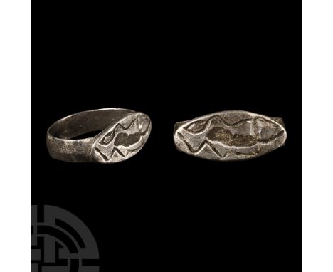 Circa 2nd century B.C. With a wide hoop supporting a lentoid bezel, intaglio design of a running quadruped with long ear or h