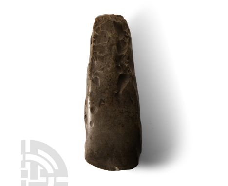 Neolithic Period, circa 5th millennium B.C. Rectangular in section with a square butt, gently curved polished edge. Cf. MacGr