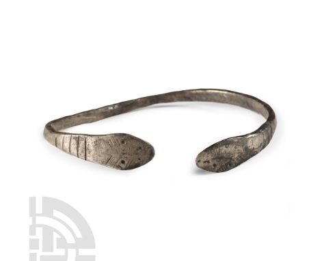 2nd-3rd century A.D. With narrow D-section shank and lobe terminals with punched snake-head detailing. Cf. Ruseva-Slokoska, L