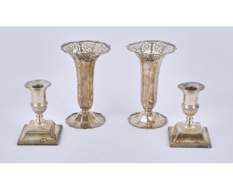 Pair of Victorian silver candlesticks with beaded borders on square bases, by Martin, Hall & Co., Sheffield, 1882, and a pair