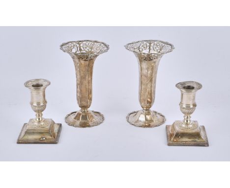 Pair of Victorian silver candlesticks with beaded borders on square bases, by Martin, Hall & Co., Sheffield, 1882, and a pair