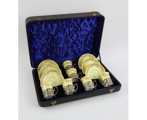 Hammersley & Co porcelain coffee set with silver cup holders by Maples & Co, Birmingham 1903, cast with cherubs and temples i