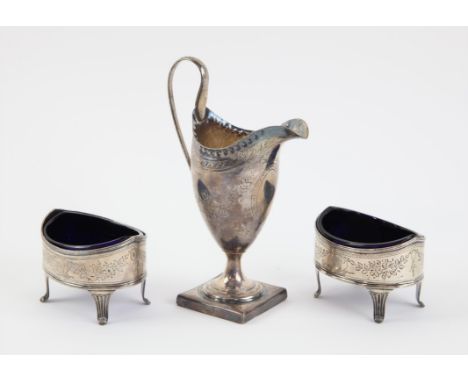 Pair of George II oval open salts the blue glass liners with star cut bases, chased foliate decoration and engraved initials,