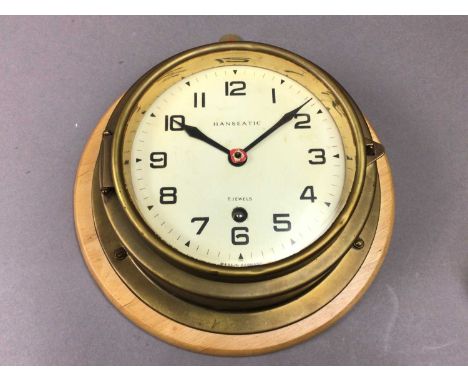the other a small brass clock by Henry Browne & Son Ltdthe bulhead 19cm diameter, brass clock 8cm diameter Qty: 2We are unabl