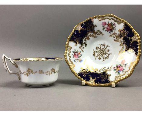comprising six cups and six saucers, each decorated with reserves of flowers within blue and gilt bordersQty: 12Some crazing 