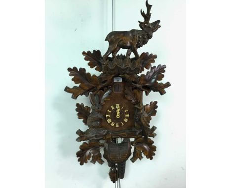 the case with stag surmount, carved with foliage, birds and a rabbitWe are unable to confirm if the clock is working.