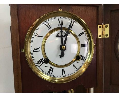 the oak cased clock the dial set with Roman numerals54cm highQty: 4