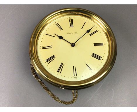 the wall clock in walnut case, along with a brass wall clock, the dial set with Roman numeralsQty: 2