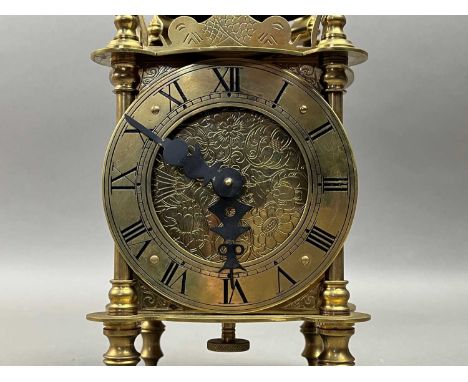 the brass clock by A.M Ovens, along with two other clocks28cm highQty: 3At the time of this condition report none of the 3 cl