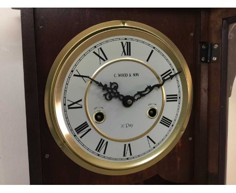 the modern wall clock in mahogany case, along with two other wall clocks65cm highQty: 3
