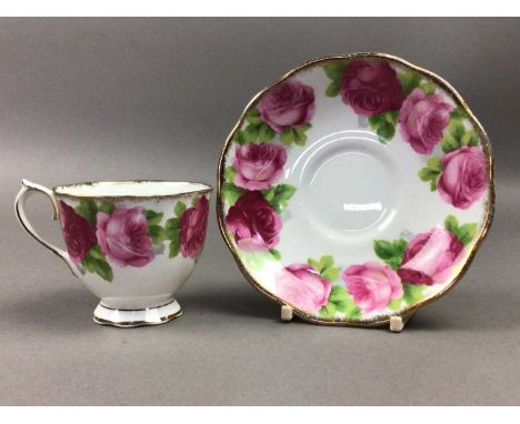 the coffee service comprising five cups and saucers, the part tea service painted with pink roses comprising four cups, five 