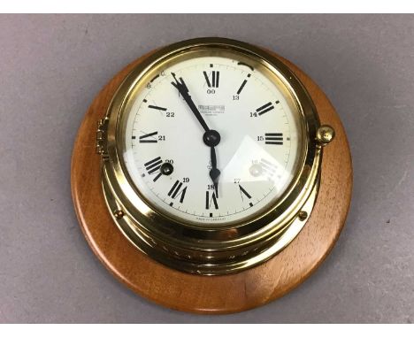 on wood base 13cm diameter At the time of this condition report the the clock is not running.
