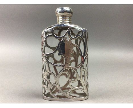 complete with lid14cm highWhite metal overlaid hip flask complete with lid, decorated in open work sinuous, No silver marking