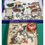 A quantity of lead farm animals and dogs and other items. Includes, cows in various poses and