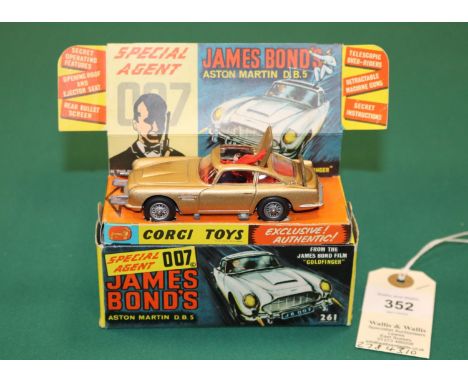 Corgi Toys James Bond's Aston Martin D.B.5 'From The James Bond Film 'Goldfinger'' (261). In metallic gold with red interior.