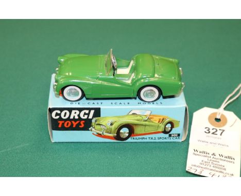 Corgi Toys Triumph TR2 Sports Car (301). An example in dark green with cream seats, smooth spun wheels with black tyres. Boxe