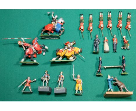 22 Lead and white metal figures, Including 7 Scottish Regiment riflemen laying down with rifles drawn, Also has one other kne