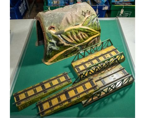 A rare Marklin tinplate tunnel. For O gauge model railways, highly detailed with a mountain scene with houses, trees river an