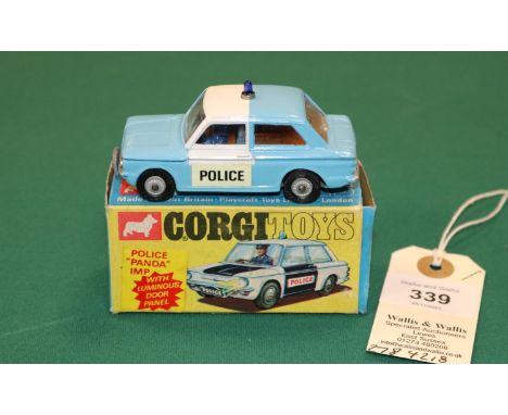 Corgi Toys POLICE PANDA Imp (506). In light blue and white, with brown interior with driver, blue light to roof, cast wheels 