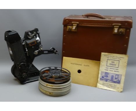 Pathescope Cine Projector No.103145 BA, with four Pathex 9.5mm films in canister, in leather carry case, H33cm   Condition Re