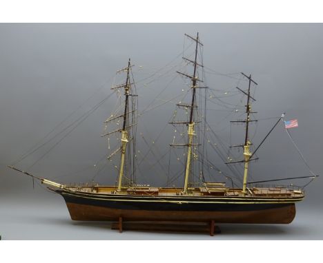 Wooden scale model of an three masted American clipper, de-rigged, on stand, L110cm, H73cm   Condition Report   Click here fo