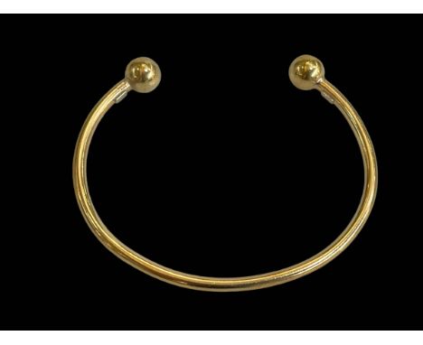 9 carat gold solid bangle.