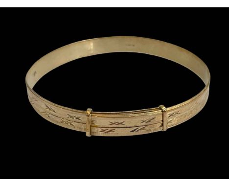 9 carat gold adjustable bangle.