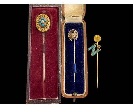 Three Victorian stick pins, one fox mask, others with turquoise.