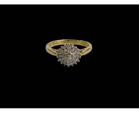 Diamond cluster 18 carat gold ring, size N.