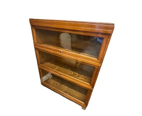 Walnut Globe Wernicke three height stacking bookcase, 111cm by 85cm by 29cm.