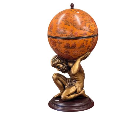 Cocktail globe on figural pedestal base.