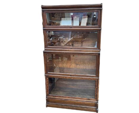 Oak Globe Wernicke four height stacking bookcase, 165cm by 86.5cm by 36cm.