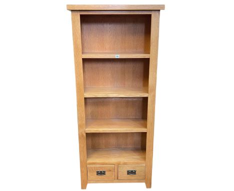 Contemporary light oak open bookcase with two base drawers, 181cm by 80cm by 32.5cm.
