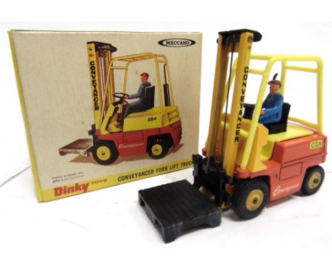 A DINKY NO.404, CONVEYANCER FORK LIFT TRUCK  yellow and orange with yellow plastic hubs, near mint (minor 'melt' to hub rims)