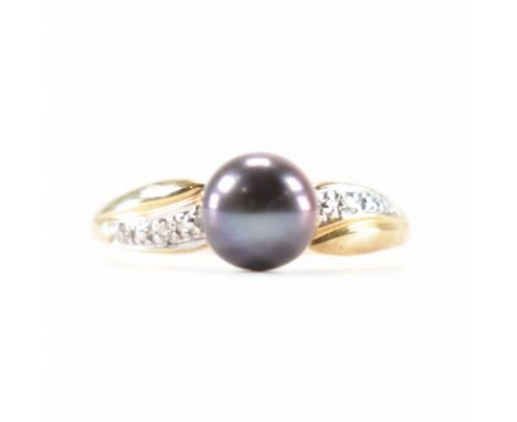A hallmarked 9ct gold pearl ring. The ring set with a black cultured pearl to diamond set shoulders and plain shank. Weight 1