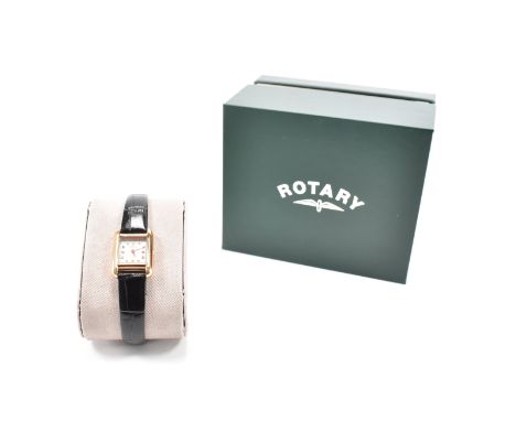 A Rotary Cambridge ladies wrist watch. The watch set with diamond set indices having an engine turned face with baton hands. 