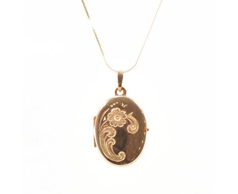A hallmarked 9ct yellow gold locket pendant &amp; chain necklace. The locket of oval form with etched floral design with hing