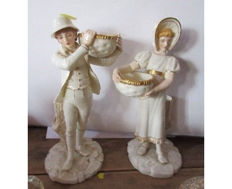 A pair of Royal Worcester Kate Greenaway style figures, of a boy and a girl holding baskets, shape number 880. height 10ins, 